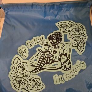 Blue Graphic Drawstring Backpack with Reading Skull Design